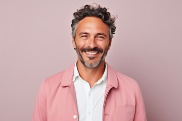 Obraz premium Medium shot portrait of a Brazilian man in his 40s in a pastel or soft colors background wearing a chic cardigan
