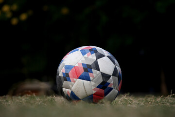 A futsal ball with a little bit dark background