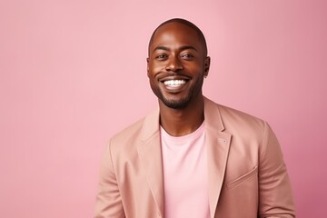 Obraz premium Medium shot portrait of a Nigerian man in his 30s in a pastel or soft colors background wearing a chic cardigan