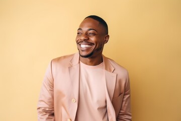 Obraz premium Medium shot portrait of a Nigerian man in his 30s in a pastel or soft colors background wearing a chic cardigan