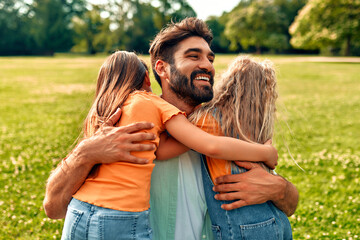 Happy family relaxing in the park