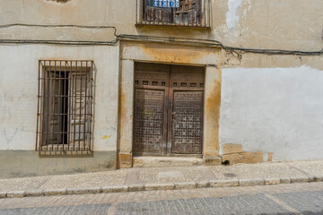 Fototapeta na wymiar sunlit rural streets, traditional houses lining up, the essence of historic Spain captured