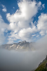 Beautiful mountain landscape with fog and clouds - 636720230