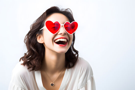 A cheerful portrait of a person wearing heart-shaped sunglass