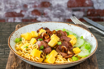 Hoisin duck with mango and egg noodles