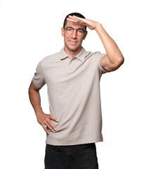 Concentrated young man with a gesture of looking far