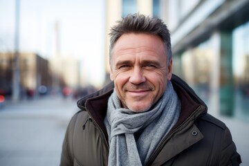 Portrait of a smiling middle-aged man on a city street