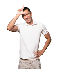 Serious young man doing a gesture of defeated