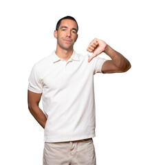 Serious young man doing a gesture of defeated