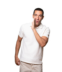 Fototapeta premium Confident young man telling a secret