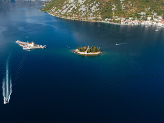 Aerial view of Our Lady of the Rocks or Gospa od Skrpjela and Catholic monastery Saint George in the bay of Kotor, in city of Perast, Adriatic sea, Montenegro. Tourism destination.