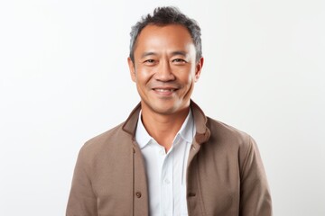 Portrait of a happy mature Asian man smiling at the camera.