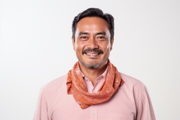 Handsome Indian man wearing pink t-shirt and red scarf