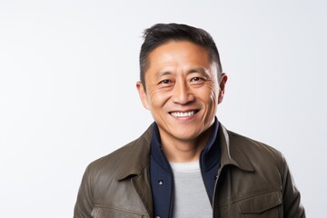 Portrait of a smiling asian man in leather jacket on white background