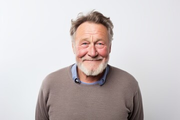 Obraz premium Portrait of a senior man with grey hair and beard on white background