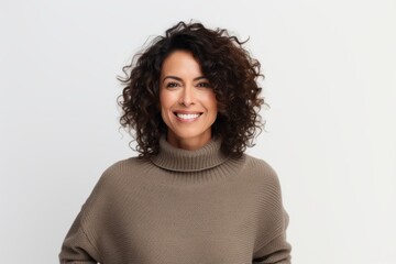 Portrait of a beautiful young woman smiling at camera over white background