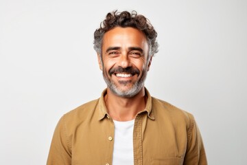 Fototapeta premium Portrait of a handsome middle-aged man smiling against a white background