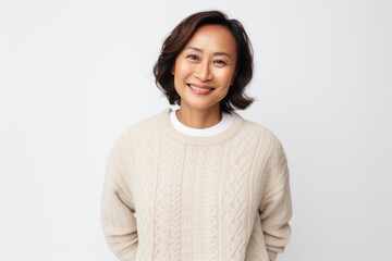 Portrait of a smiling asian woman looking at camera over white background