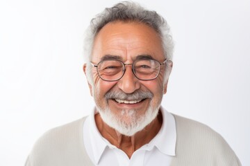 Portrait of happy senior man with eyeglasses looking at camera