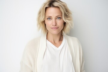 Obraz premium Portrait of a beautiful young woman with short blond hair looking at camera