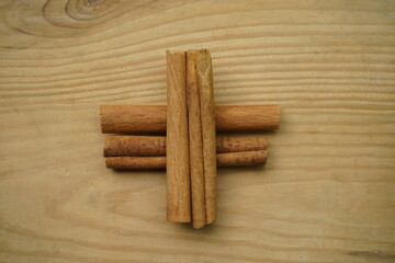 Cinnamon sticks  on wooden background ,top view