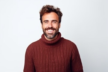 Portrait of a happy man smiling at camera isolated on a white background