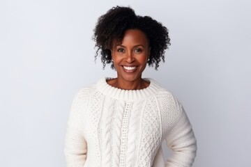 Portrait of a smiling african american woman standing against grey background
