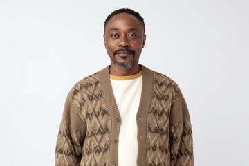 Obraz premium Portrait of an African-American man in a sweater on a white background
