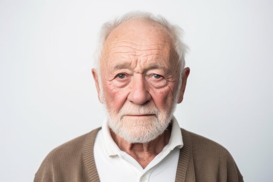 Portrait of an old man looking at the camera isolated on a white background