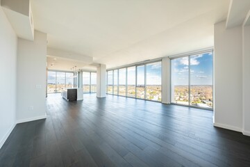 Modern living room with a black hardwood floor and a view through the windows