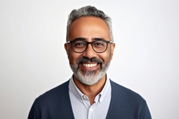 Portrait of happy Indian man in eyeglasses looking at camera