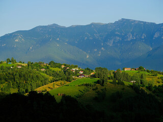 Naklejka premium Scenic view over Bucegi Mountains (Muntii Bucegi) in Romania in a sunny sunset summer day, Romania, Europe