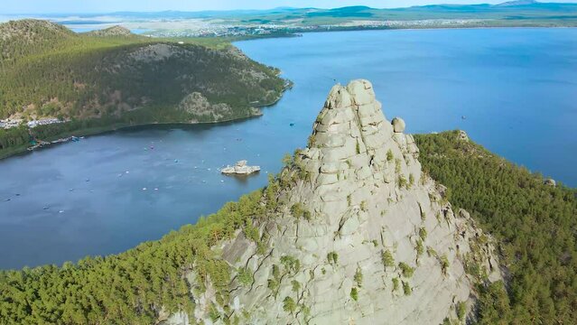 Blue Bay, lagoon in the mountains.Turquoise reservoirs on mountain peaks.Burabai National Park in Kazakhstan.The mountain range of Mount Sinyukha.A tourist trip. Flying on a mountain peak,drone. lake