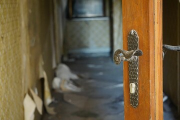 the front door to the run down room has a large knob