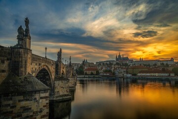 Scenic view of the Charles bridge in Prague, Czechia at sunset