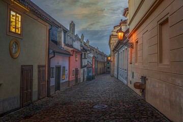 Fototapeta premium Scenic view of colorful houses of Golden lane in Prague, Czechia at sunset