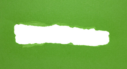 Green torn paper or cardboard message backdrop with rough edges and blank copy space for text, png...