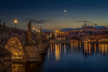 Scenic view of the Charles bridge in Prague, Czechia at sunset