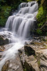 Fototapeta na wymiar Handheld shot taken of a waterfall in The Rock garden, darjeeling