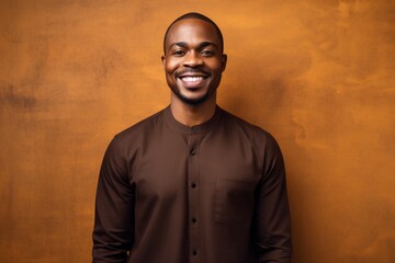 Obraz premium Medium shot portrait of a Nigerian man in his 30s in an abstract background wearing a chic cardigan