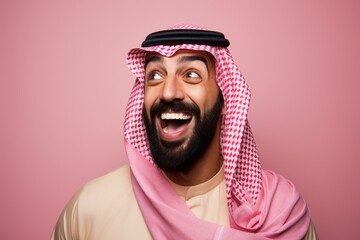 Portrait of a Saudi Arabian man in his 30s in an abstract background wearing a pair of leggings or tights