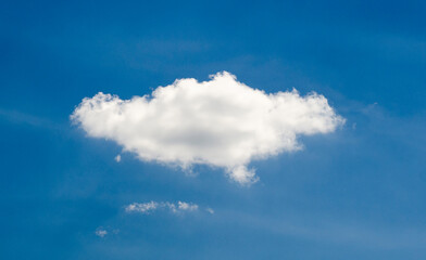 Naklejka na ściany i meble Single cloud in deep blue summer sky