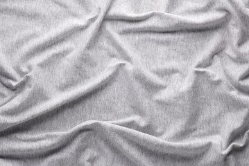 Wavy gray fabric background. Cotton Texture