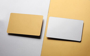 Blank Silver metal and gold business cards close up