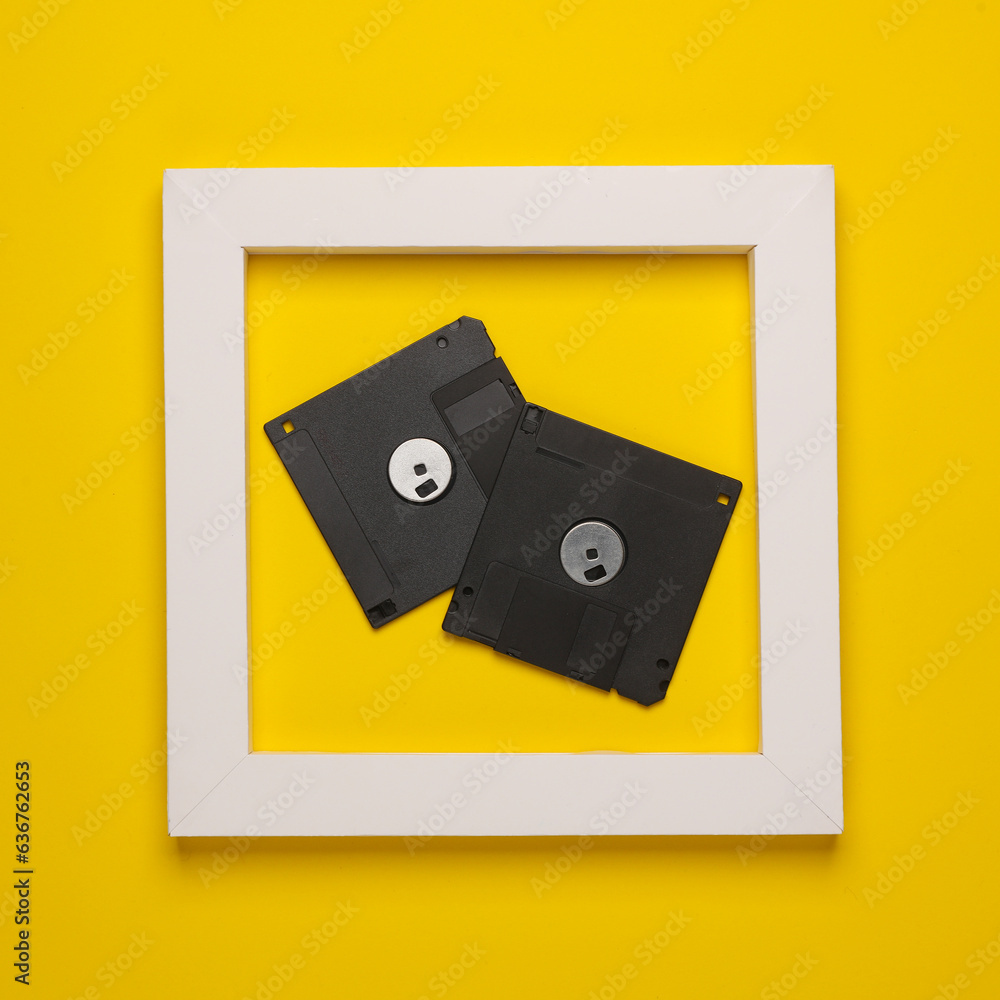 Poster retro floppy disks in white frame on yellow background. creative layout. minimalism