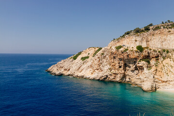 Beautiful seascape on a sunny day In Turkey. The Mediterranean Sea, surrounded by mountains, with picturesque islands on a summer day. Summer background with blue ocean