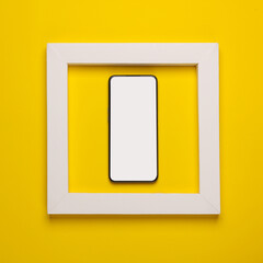 Smartphone in white frame on yellow background. Creative layout. Minimalism