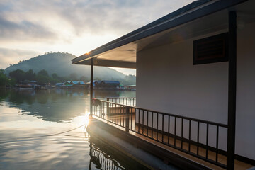 float homestay resort with over lake at sunrise in Srinakarin dam