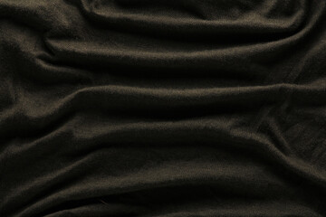 Texture of wavy dark fabric closeup