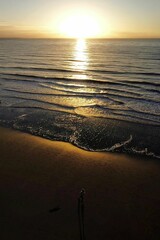 Picturesque scene of an ocean at dusk, with dark blue waves
